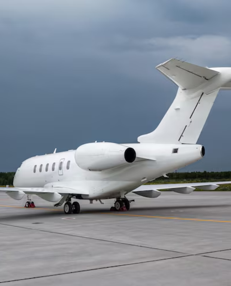 Private corporate jet parked on runway